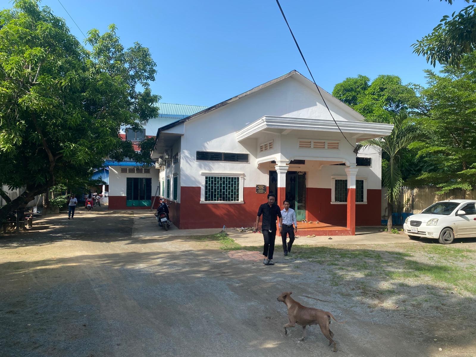 The low white and red school building at the first GTIS site